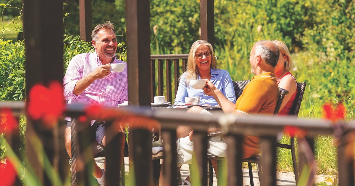 Guests at Potters Resorts Five Lakes enjoying a coffee break in the sunshine